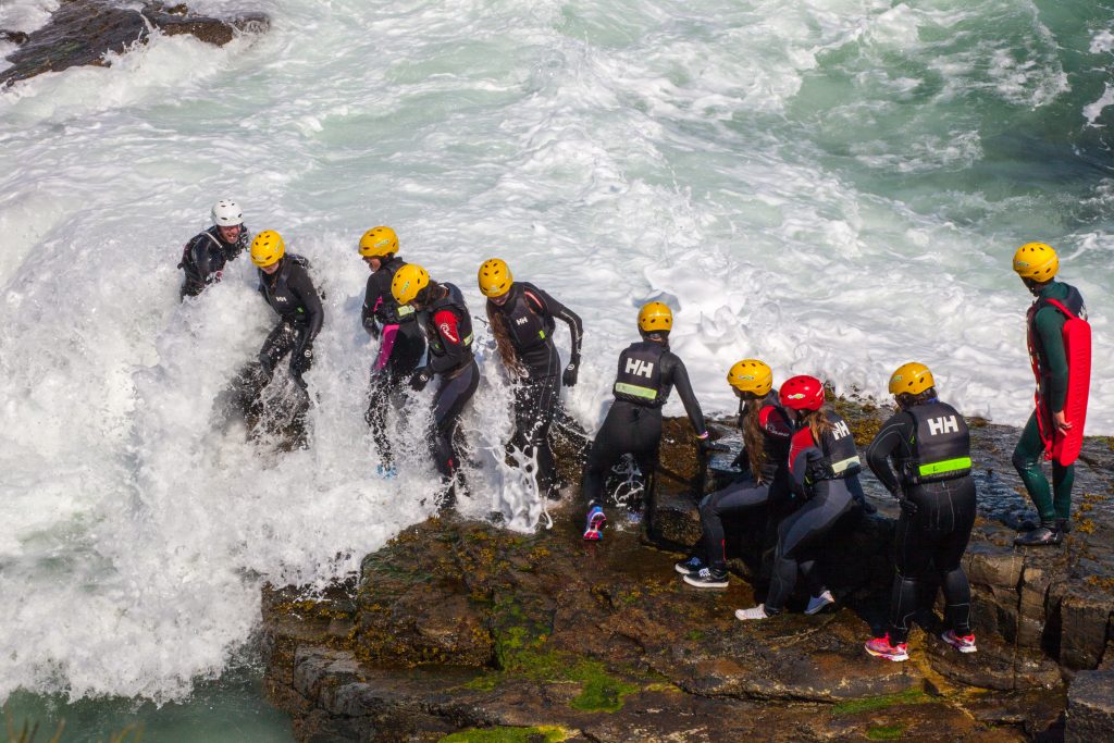 wave crashing into people